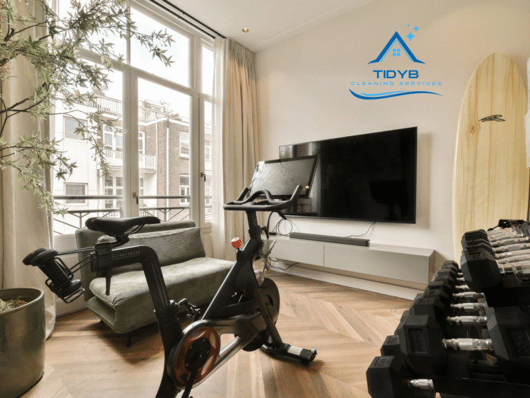 Professional cleaner sanitizing home gym equipment