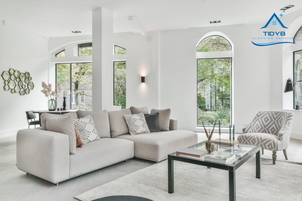 Bright living room with clear, streak-free windows and polished furniture