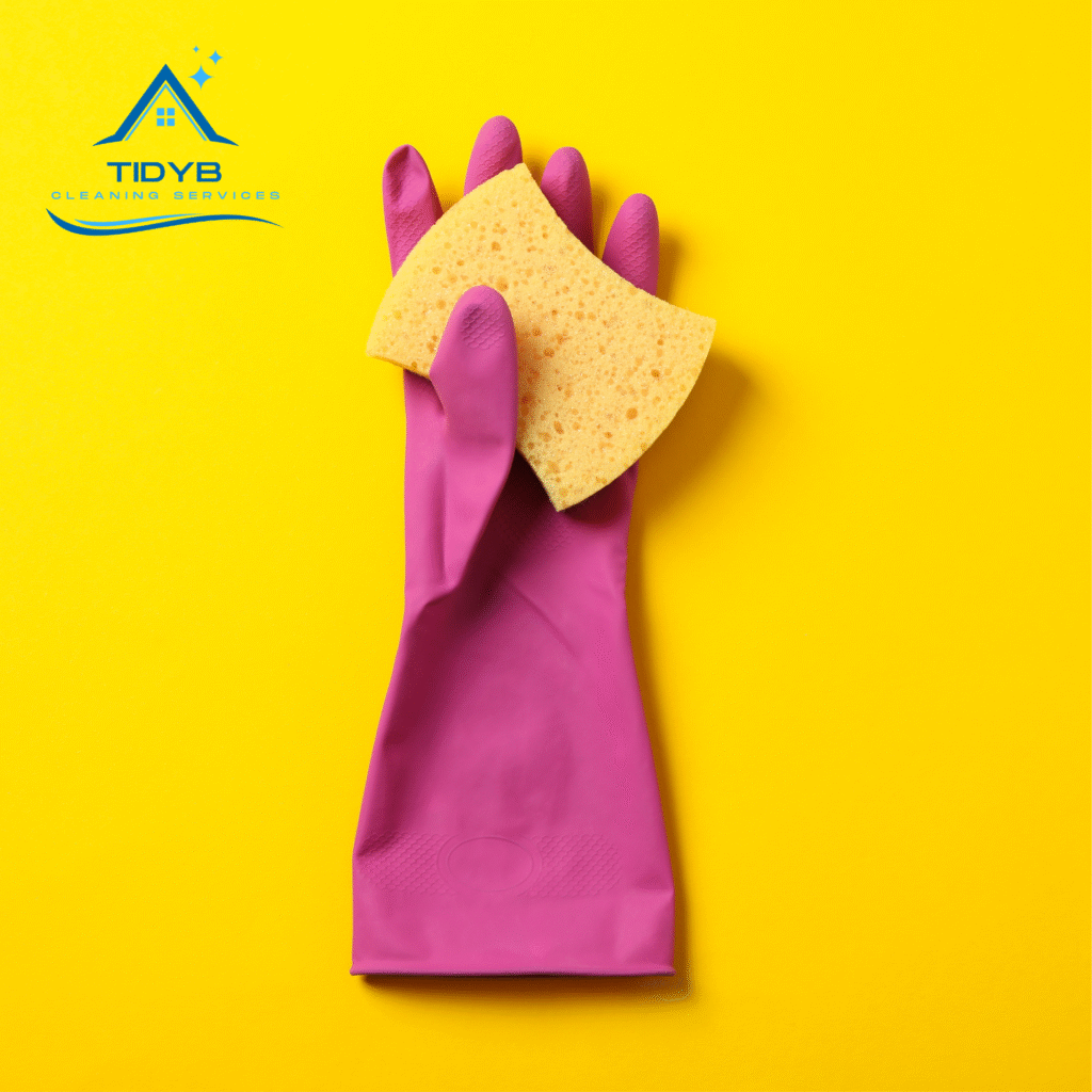 cleaning glove holding a sponge ready to scrub surfaces